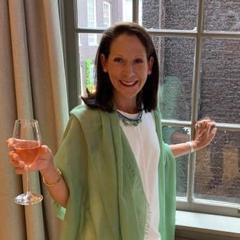 Toasting a glass of wine before going out to dinner in Amsterdam