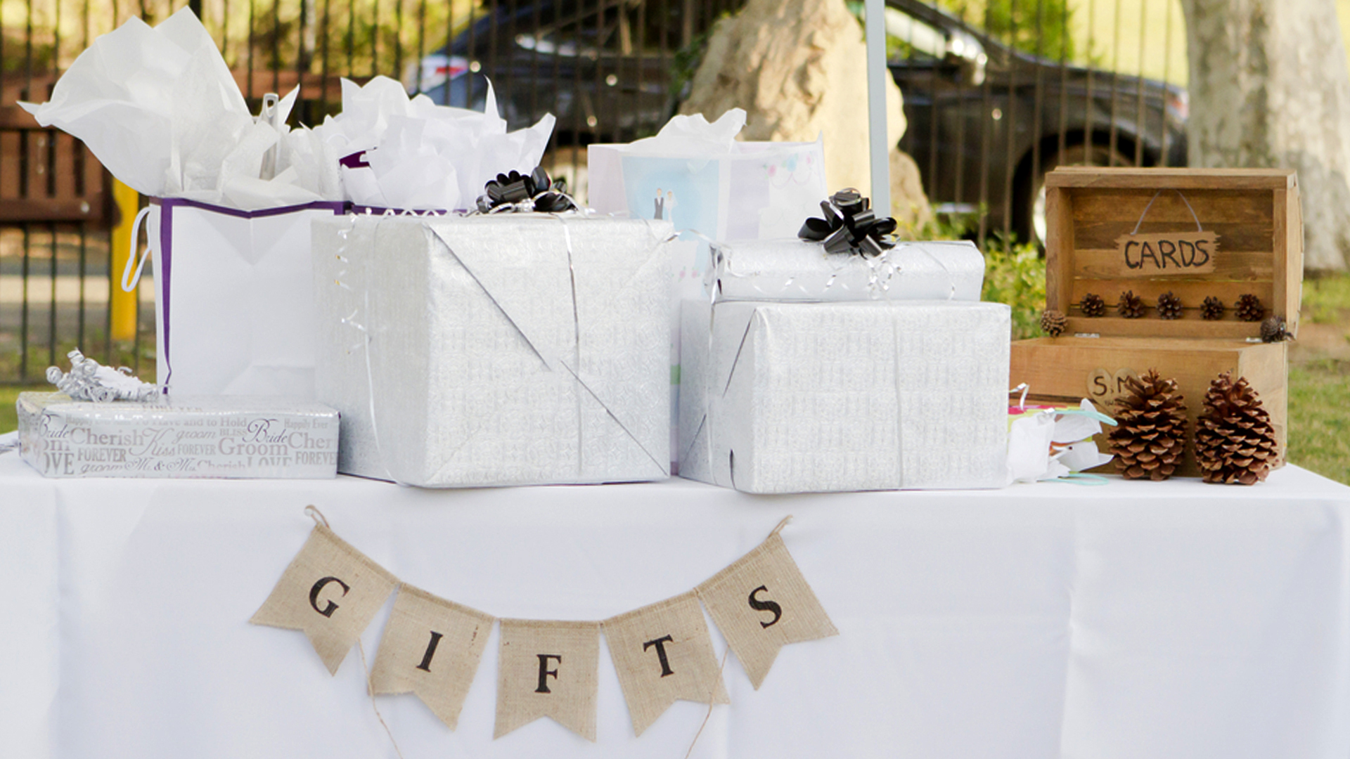 Several wedding gifts wrapped and on a table