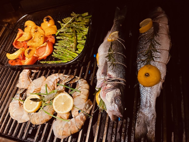 Grilled Herb and Citrus Stuffed Bronzino with Shrimp and Vegetables